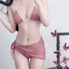 A woman models a red plaid bikini set featuring a halter push-up top and low-rise waist.