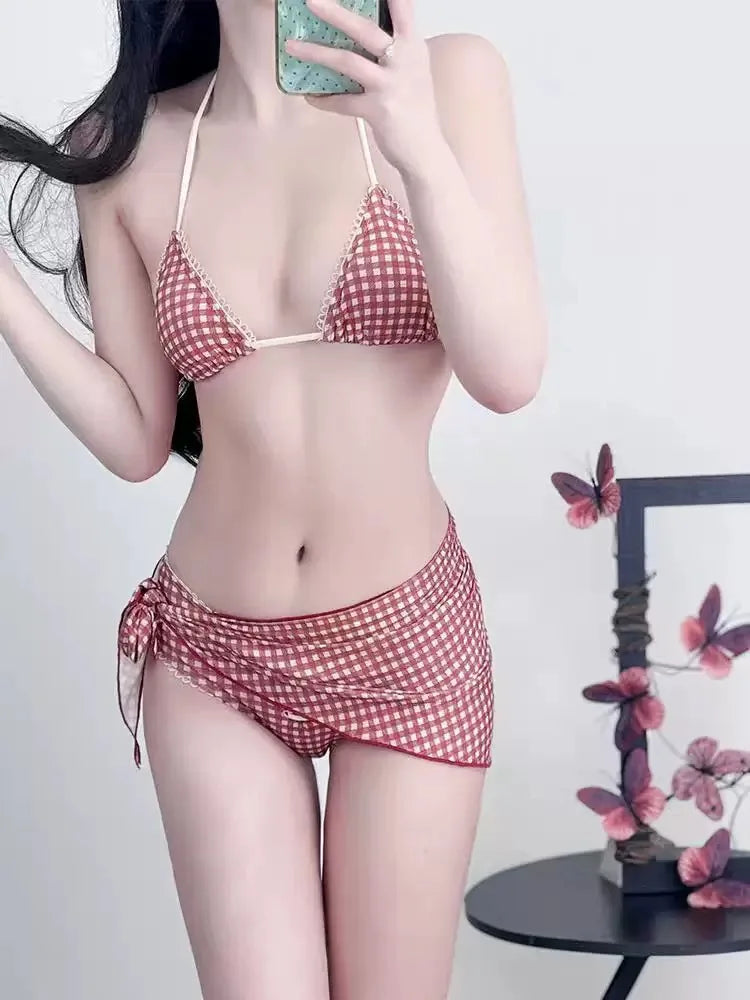 A woman models a red plaid bikini set featuring a halter push-up top and low-rise waist.