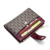 A dark brown leather folding wallet with a patterned cover and gold-toned zipper visible.