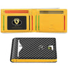 A yellow leather card holder with a black geometric design and a gold logo.