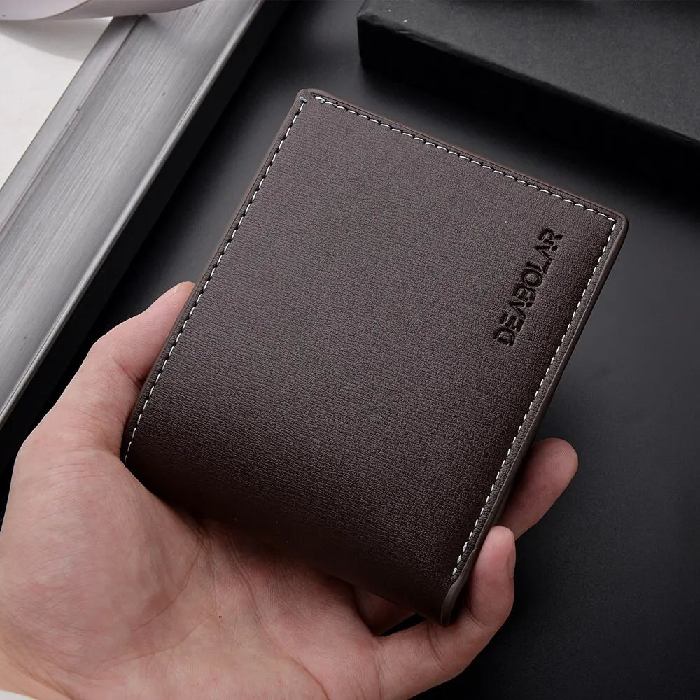 A dark brown men's PU leather folding wallet is held in a hand against a black background.