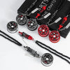 A collection of black and red alloy wheel hub brake disc rearview mirror pendants displayed on a dark box.