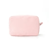 A pink seersucker striped cosmetic bag with a zipper closure.