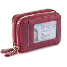 A maroon PU leather card and ID wallet with a zipper closure and attached leather strap.