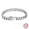 Sterling silver punk charm bracelet featuring a padlock clasp and chain links.