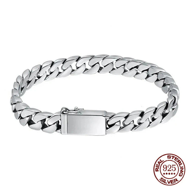 Sterling silver punk charm bracelet featuring a padlock clasp and chain links.