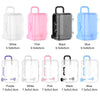A collection of miniature doll suitcases in various colors including white, pink, black, blue, and purple.