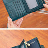 A dark teal passport wallet is shown being held by a hand, displaying the interior and exterior of the multi-functional PU le