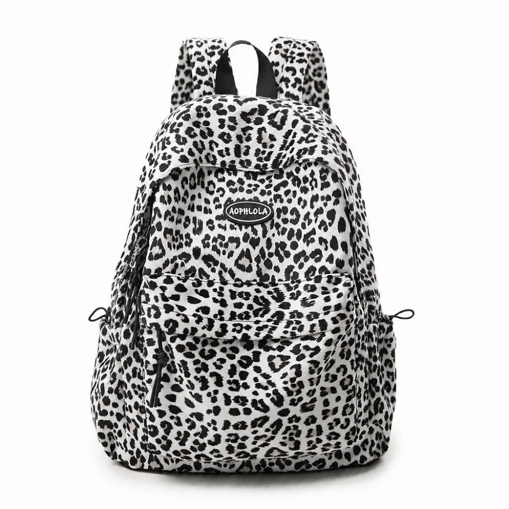 A leopard print laptop backpack with padded straps.