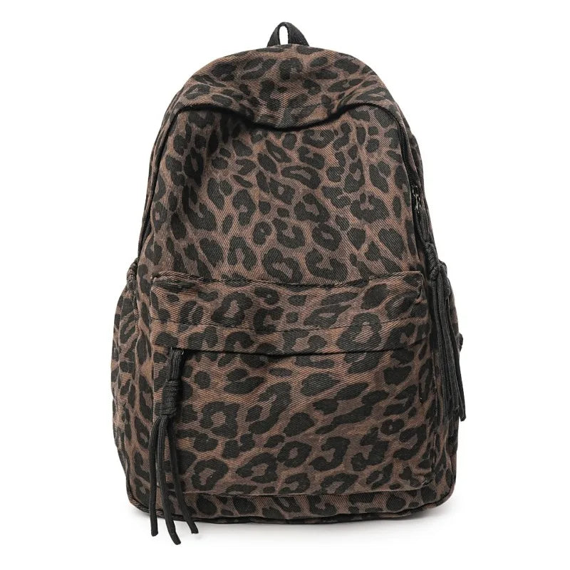 A brown leopard print canvas backpack shown from the back.