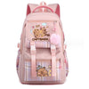 A pink canvas backpack featuring a cute capybara print and plaid accents.