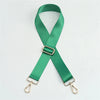 A green nylon adjustable shoulder strap with metal clasps, shown in an 'X' shape.