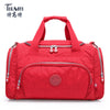 A red durable nylon travel duffle bag with dual handles and zippers.