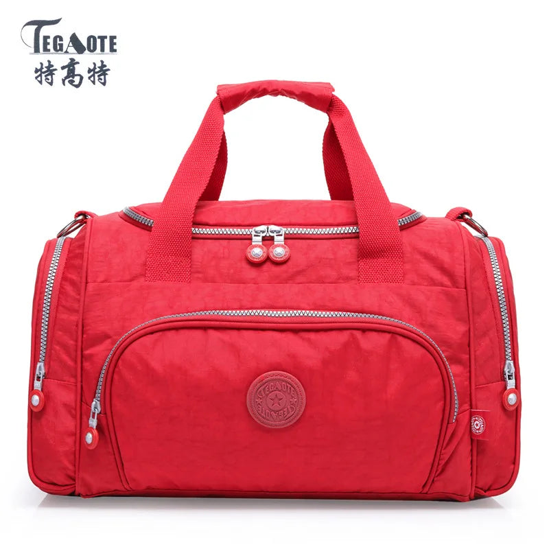 A red durable nylon travel duffle bag with dual handles and zippers.