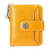 A bright yellow leather wallet with a clasp closure and card slots.