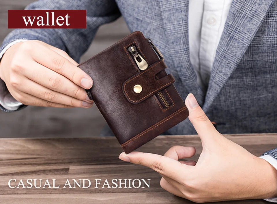 A hand holds a dark brown genuine leather bifold wallet with a double zipper and RFID protection against a gray suit jacket.