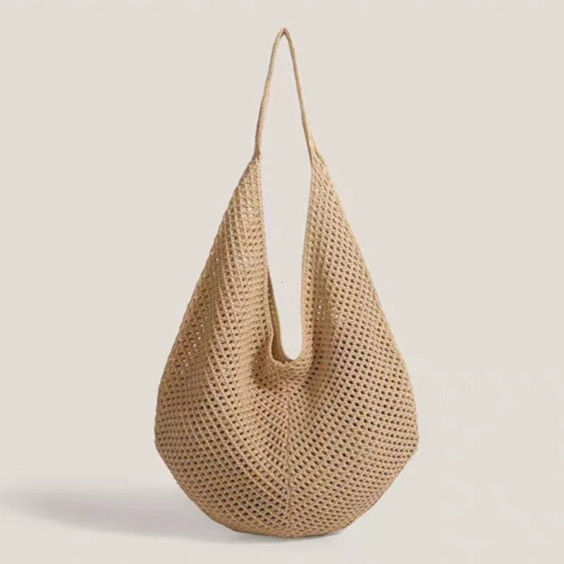 A beige crochet shoulder bag with a mesh detailing, shown against a light background.