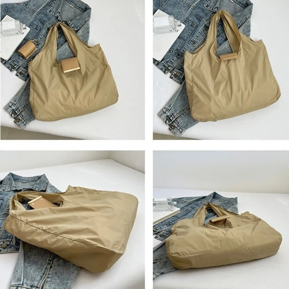 A beige foldable mini keychain tote bag shown in various angles against a denim background.