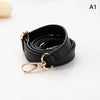 A black PU leather strap with a gold-toned buckle is shown coiled and laid out on a white background.