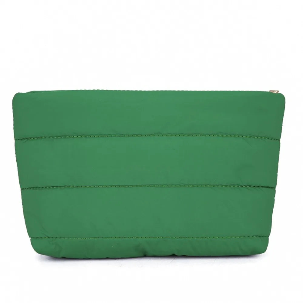 A dark green quilted cosmetic travel bag with a gold zipper detail.