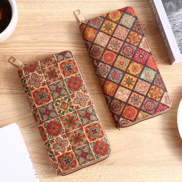 A patterned bohemian wood-grain leather wallet with multiple card slots resting on a light wooden surface.
