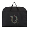 Black fabric dust cover and storage bag with a decorative ornate letter Q embroidered on it.