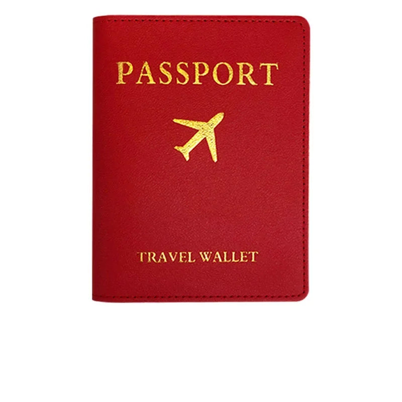 A red PU leather passport holder with gold foil printing of an airplane symbol and the word PASSPORT.