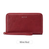 A maroon leather wallet with a zipper closure and the brand name MIYIN visible on the surface.