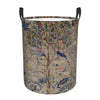 A vintage floral laundry hamper with a light beige fabric and green metal wire frame.