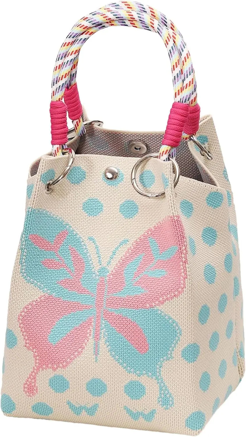 A knitted bucket bag featuring a light beige background with pink and blue polka dots and a large pink and blue butterfly des