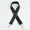Black adjustable crossbody strap with gold-toned hardware