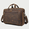 A brown genuine leather briefcase with a top handle and flap, shown from the front.