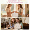 Two girls hold a quilted floral Bible cover with pen holder in a church setting.