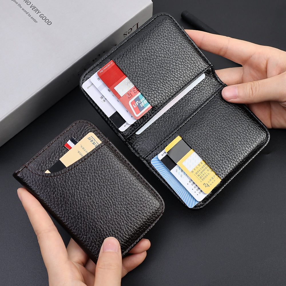 A black slim PU leather credit card wallet is shown open, displaying various cards and held by a hand against a gray box.