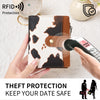 A hand holds a brown and white patterned wallet with RFID protection features, demonstrating theft protection for data safety