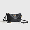 A black classic split leather shoulder tote bag with gold hardware shown against a light background.