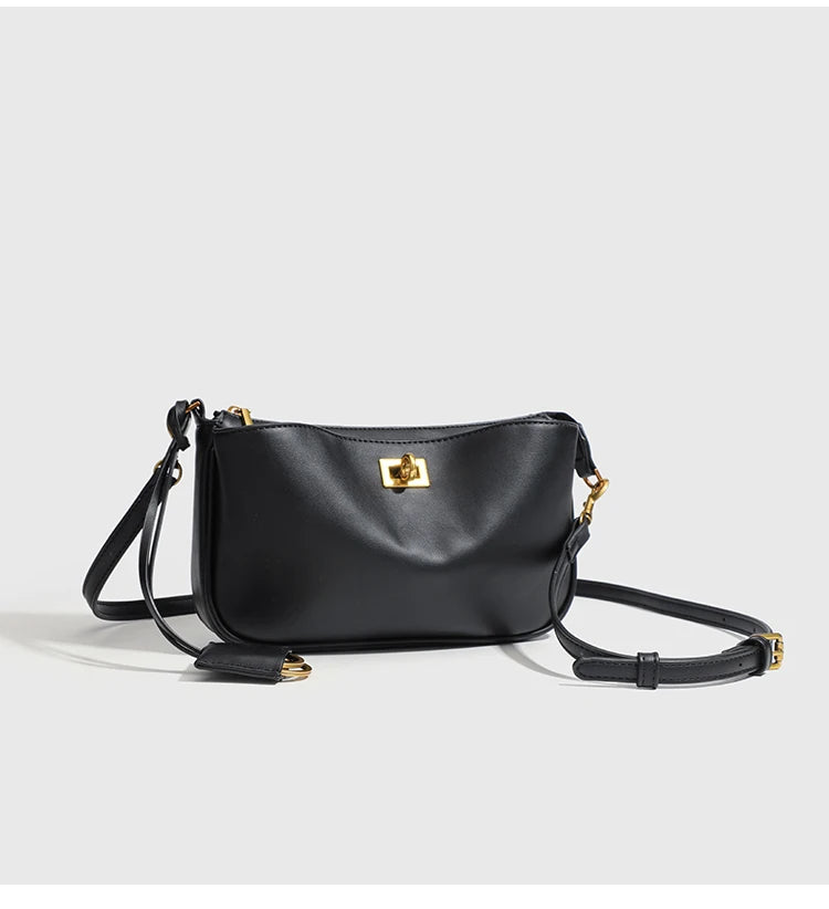 A black classic split leather shoulder tote bag with gold hardware shown against a light background.