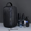 Black premium PU leather toiletry bag for men with a silver razor and bottle.