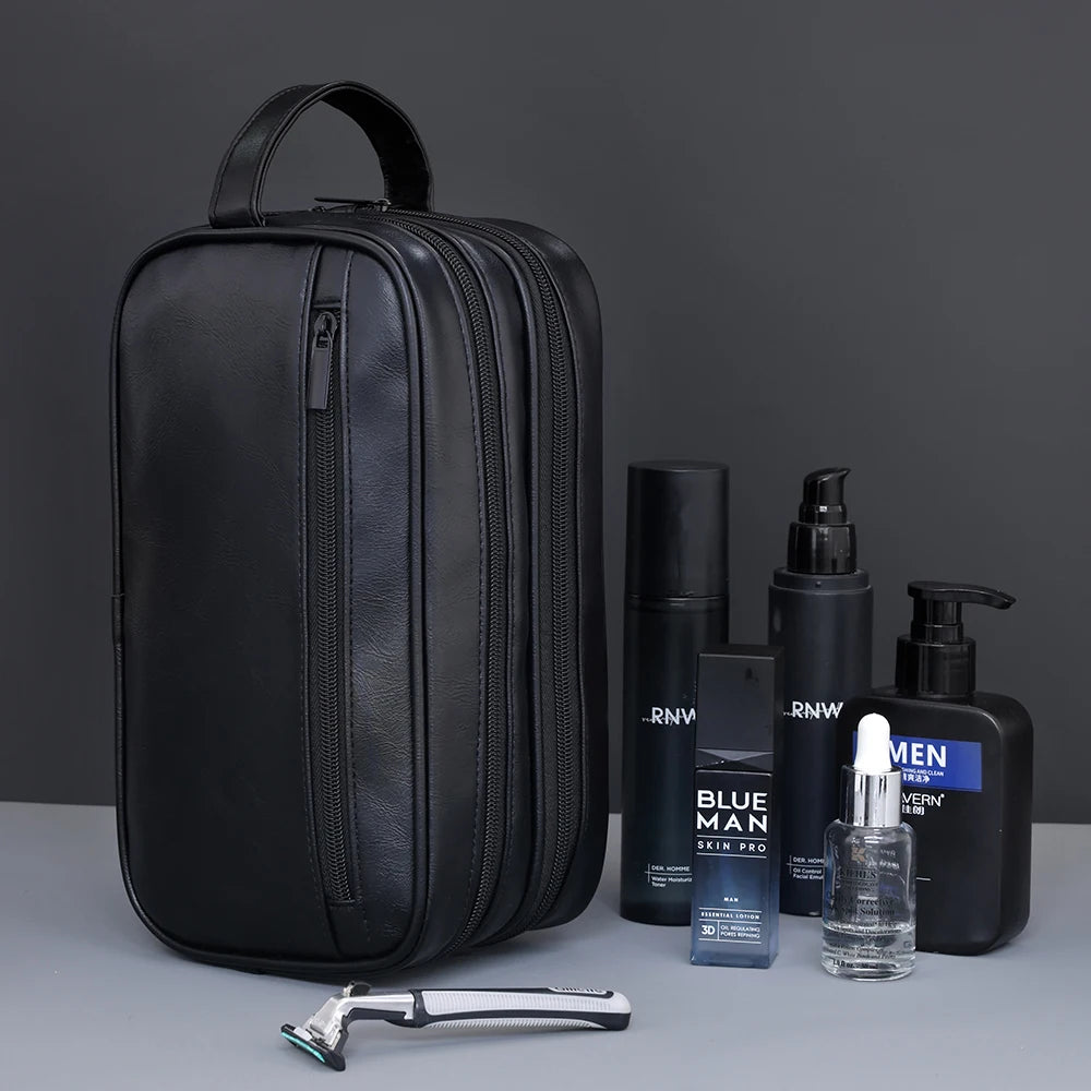 Black premium PU leather toiletry bag for men with a silver razor and bottle.