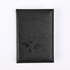 Black leather passport holder with the word PASSPORT and a world map design embossed on the cover