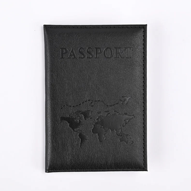 Black leather passport holder with the word PASSPORT and a world map design embossed on the cover