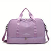 A purple nylon travel duffle bag with pink straps and a zipper closure.