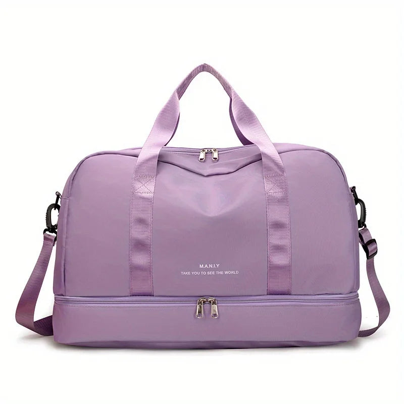 A purple nylon travel duffle bag with pink straps and a zipper closure.