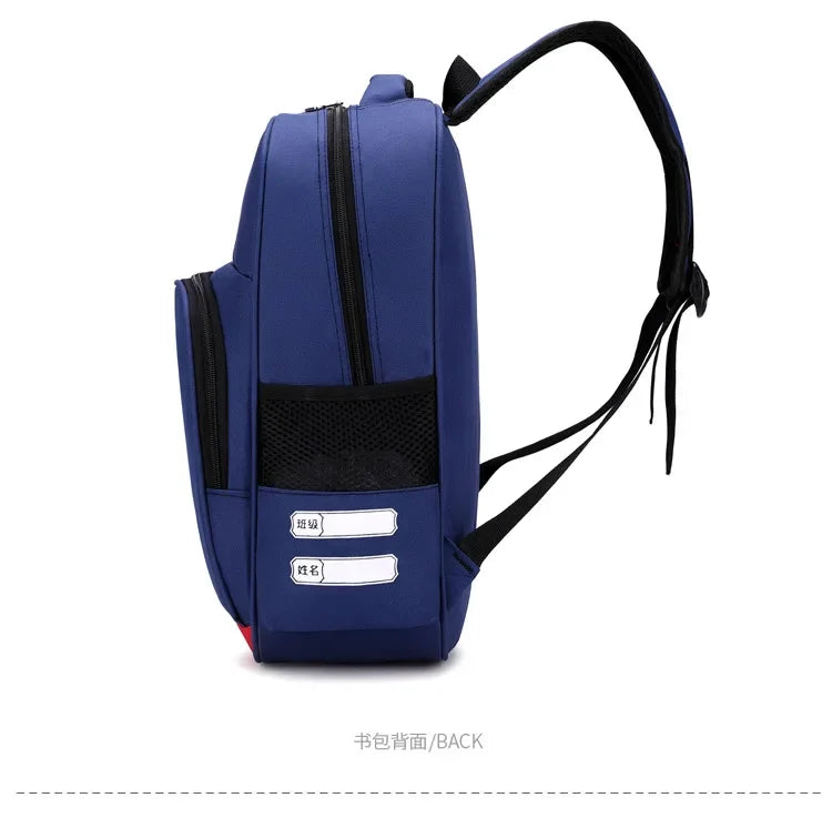 A dark blue cartoon anime backpack with black zippers and a black strap, shown from the back.