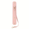 A pink vintage leather glove holder strap with a metal clasp and leather loop.