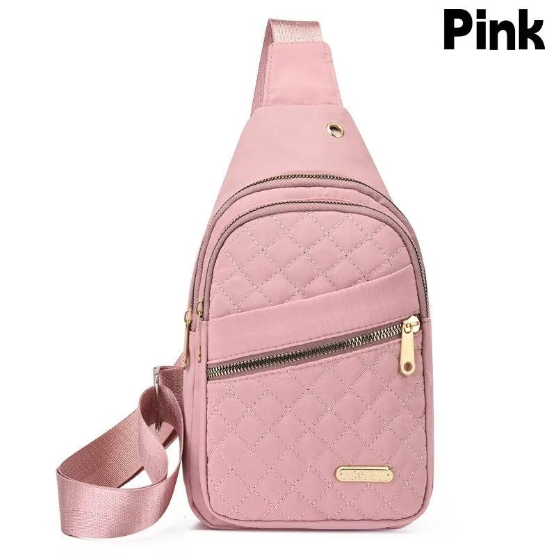 Pinkes, wasserdichtes Crossbody-Sling-Bag für Damen mit gesteppter Textur und Reißverschlussschnüre.