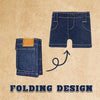A dark indigo denim mini wallet with a leather accent is shown next to a pair of denim shorts, illustrating a folding design.