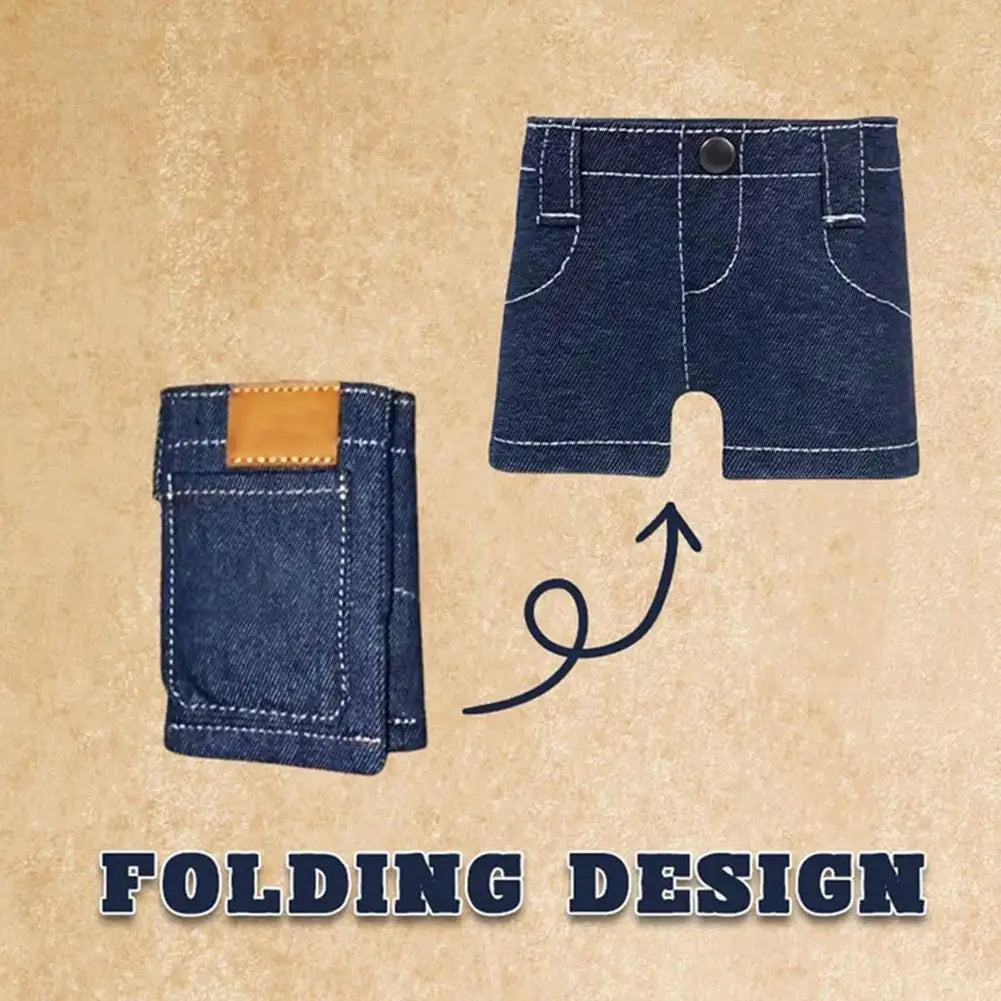 A dark indigo denim mini wallet with a leather accent is shown next to a pair of denim shorts, illustrating a folding design.
