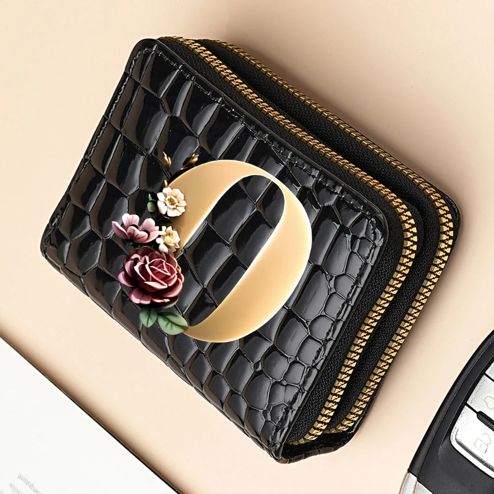 A black PU leather double-zip clutch wallet with a gold zipper and a cream-colored curved print.
