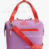 Purple insulated cooler lunch bag with an orange strap and silver hardware